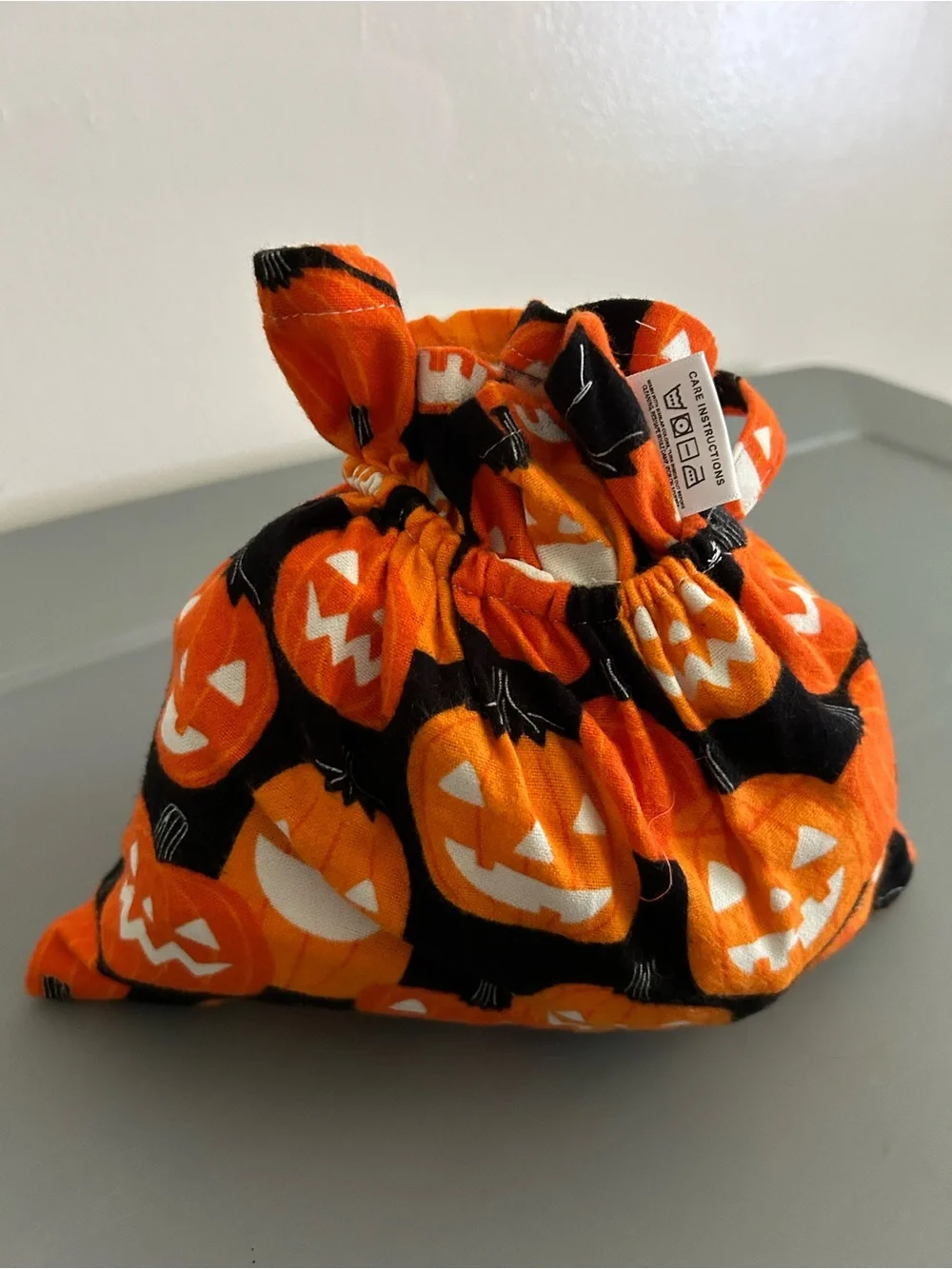 Pumpkin glow in the dark costume shopping cart liner with matching handbag